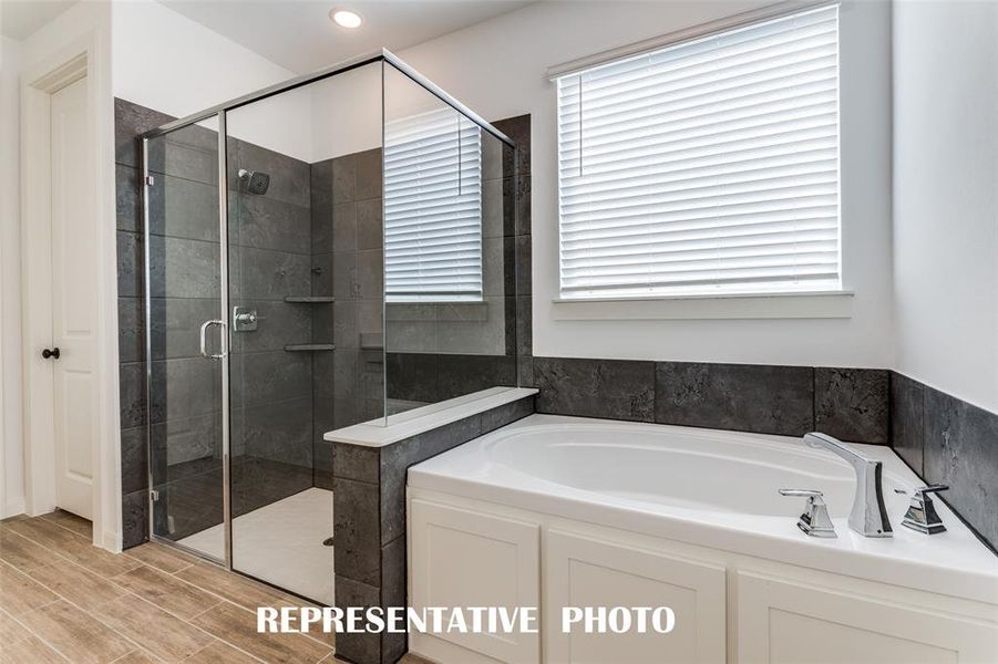 Your new owner's bath comes complete with a relaxing garden tub and oversized, walk in shower.  REPRESENTATIVE PHOTO.