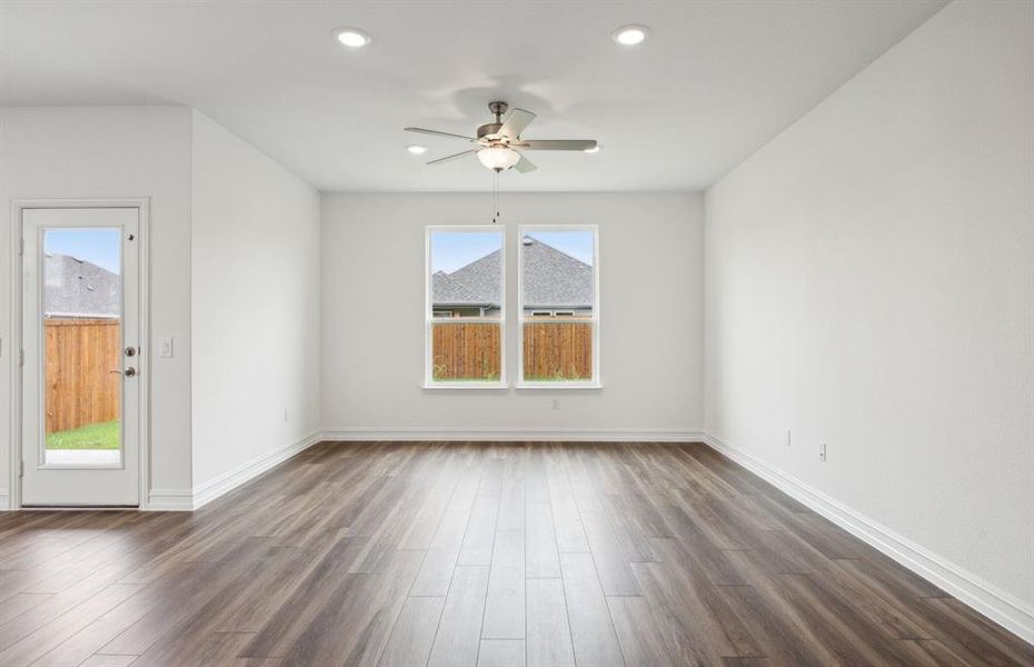 Bright gathering room with large windows*real home pictured