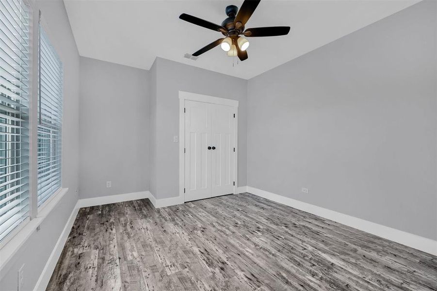 Spare room featuring light hardwood / wood-style floors and ceiling fan