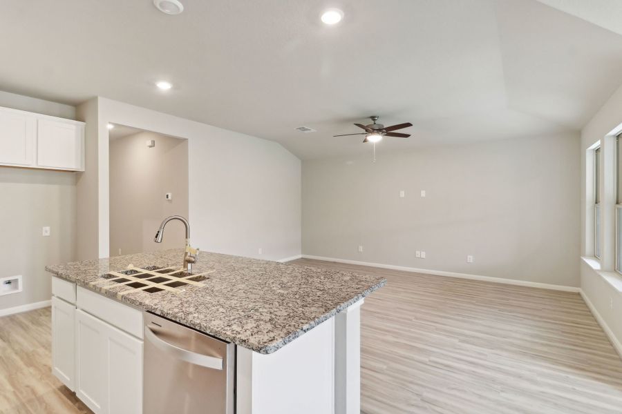 Kitchen and living room in the Callaghan floorplan at a Meritage Homes community.