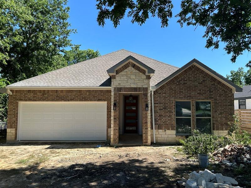 View of front of property with a garage