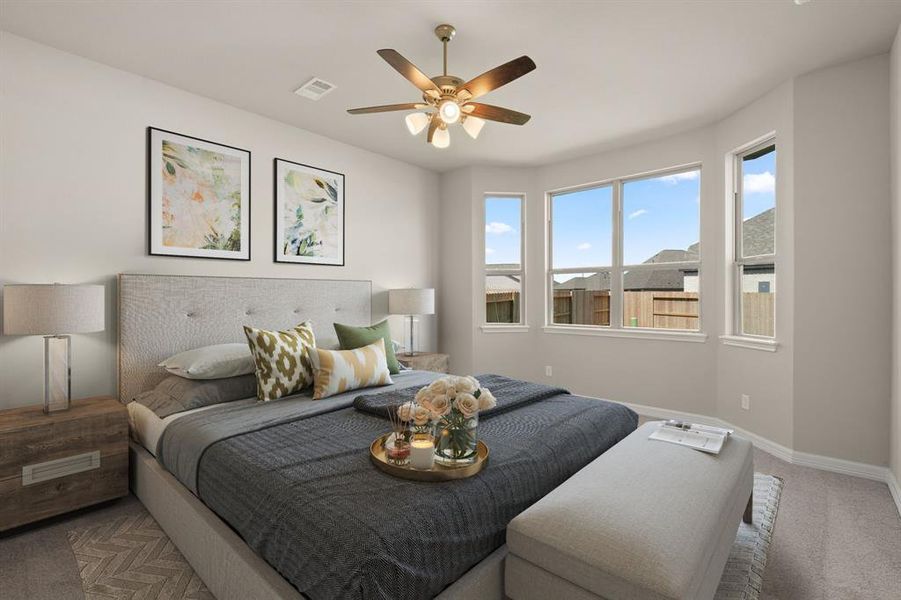 The primary bedroom is generously sized, creating a tranquil and spacious retreat that offers ample room for relaxation. Featuring plush carpet, high ceilings, fresh paint, and large windows that lets in natural lighting throughout the day.