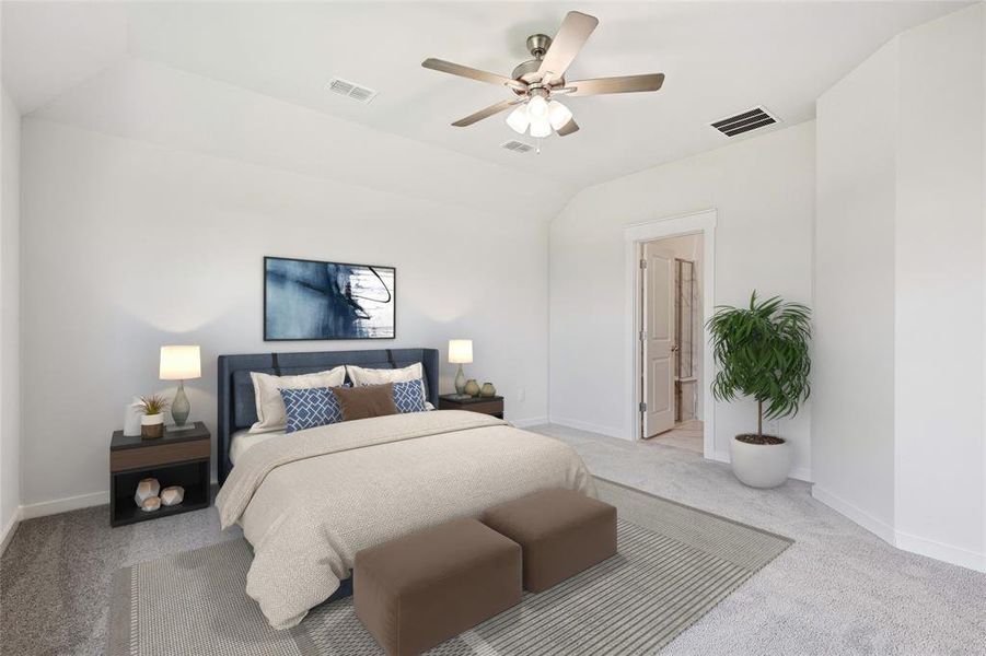 Bedroom with ceiling fan, light carpet, vaulted ceiling, and ensuite bathroom