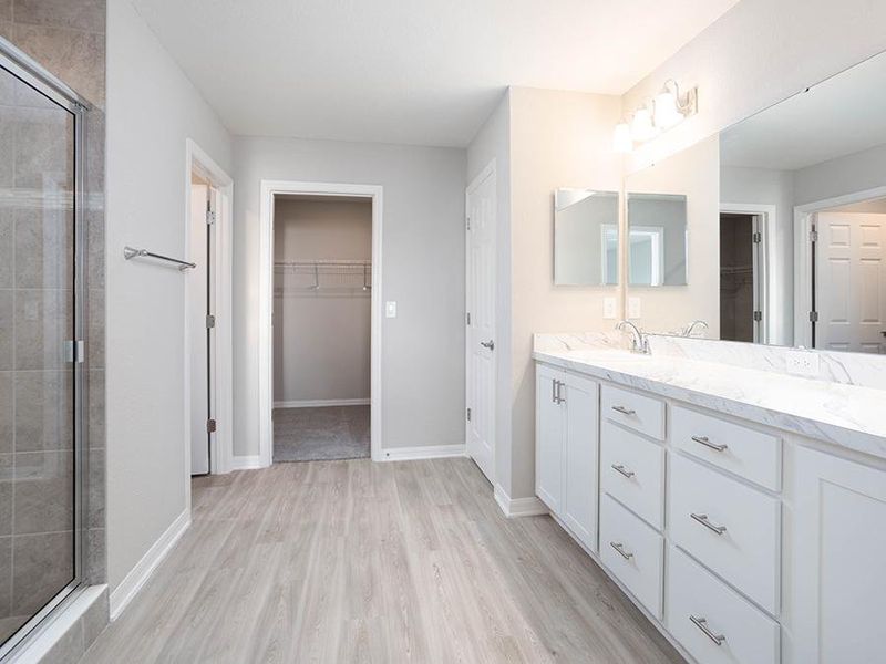 The in-law suite is complete with a spacious en-suite-bath and walk-in wardrobe - Wayfair II home plan by Highland Homes