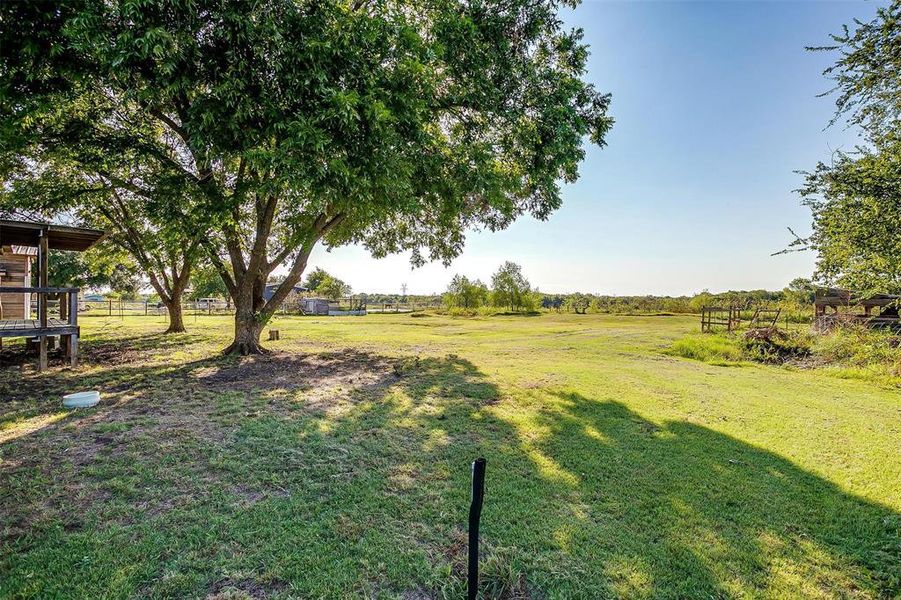 View of yard with a rural view