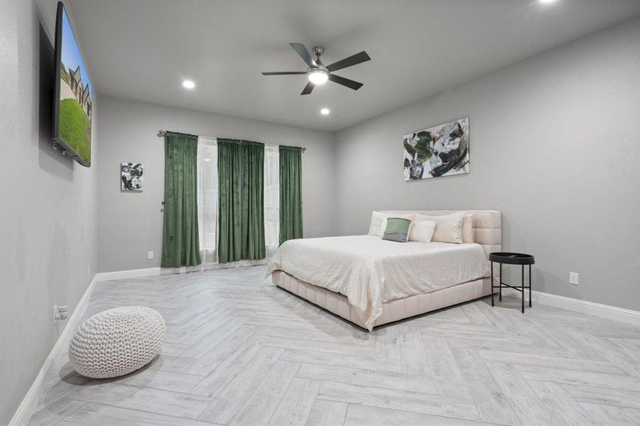 Bedroom featuring light parquet flooring and ceiling fan