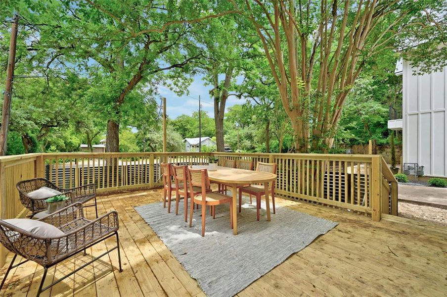 The terrace offers ample space for creating another living area, complete with a cozy coffee table setup. This outdoor extension provides a perfect setting for relaxation and gatherings, surrounded by the beauty of the lush surroundings.