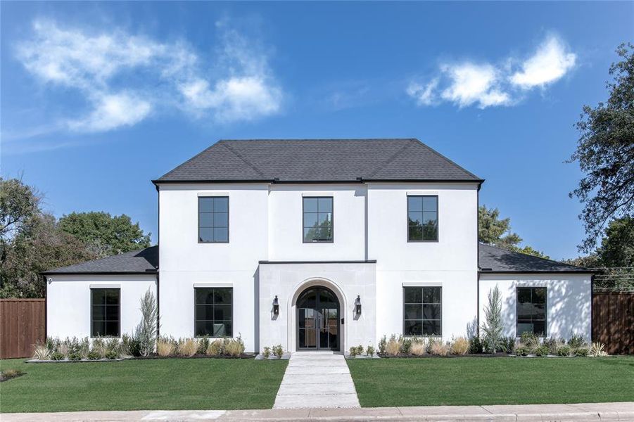 View of front of property with a front yard