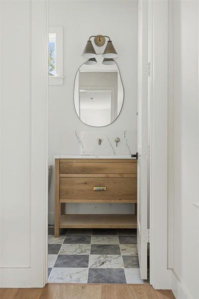 Bathroom featuring vanity and hardwood / wood-style floors