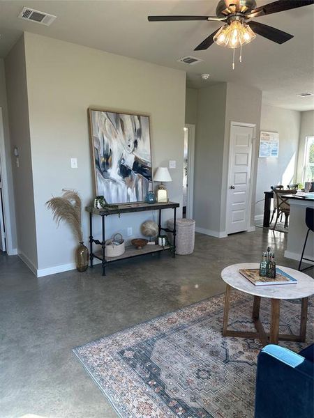 Living room featuring ceiling fan