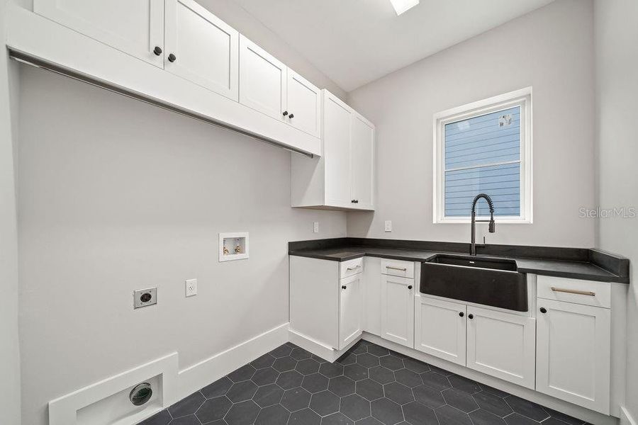 Laundry on first floor is one of two laundry rooms