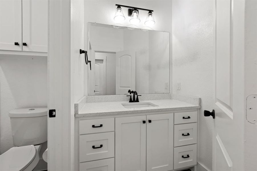 Bathroom with toilet and vanity