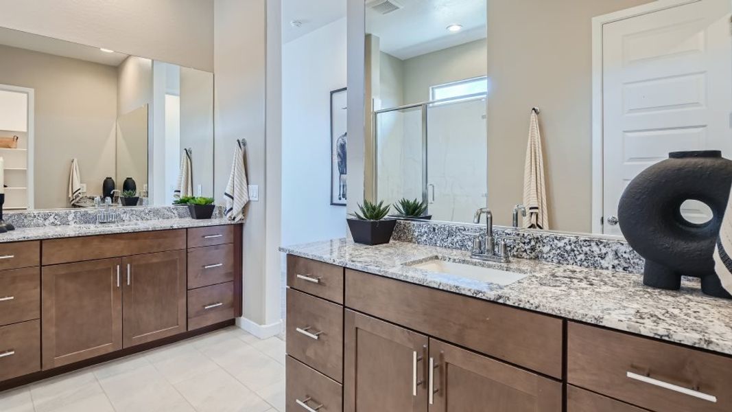 owners bathroom with dual sinks