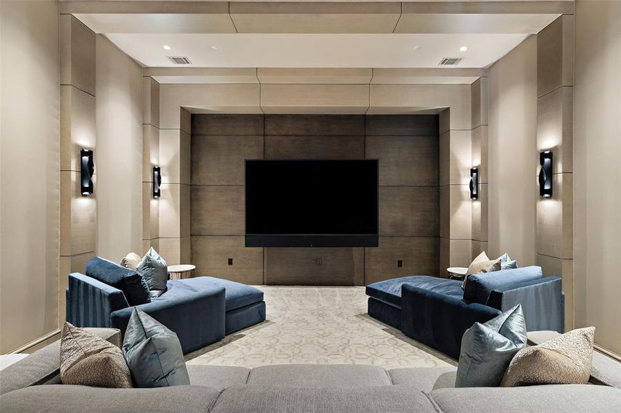 Experience the ultimate cinematic escape in the media room, where state-of-the-art audiovisual technology and plush seating combine to create an immersive home theater experience.