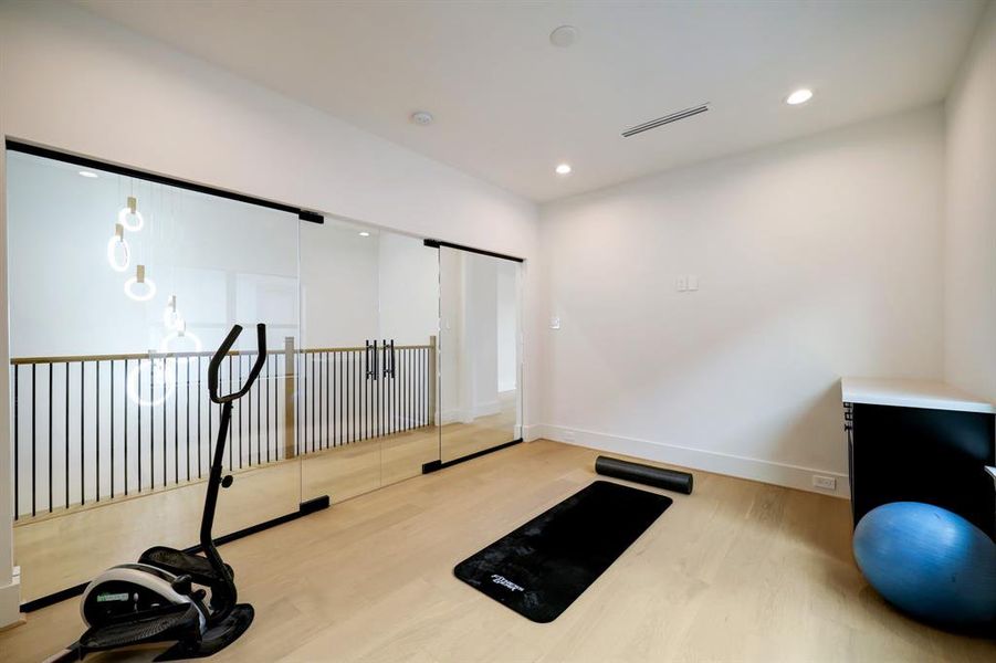 Versatile bonus room showcased as a sleek home gym—ideal for your office, play area, or creative space.