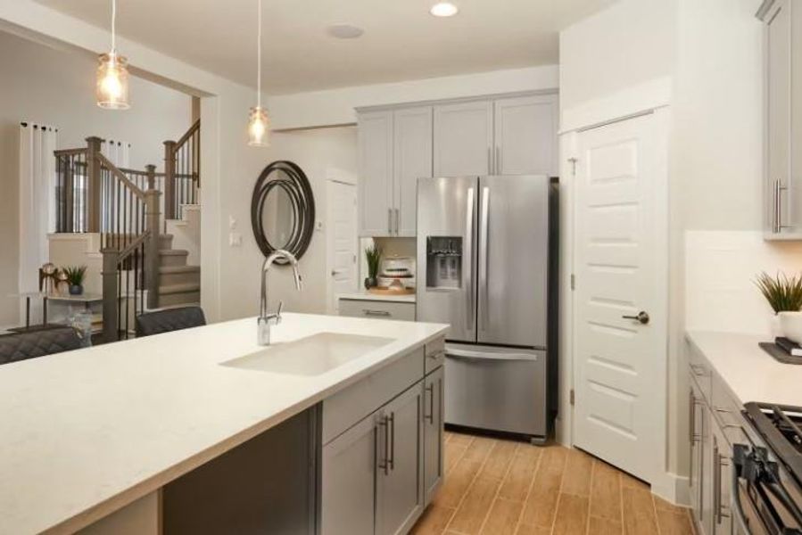 Photo of Pulte model home with same floor plan, not of actual home listed.