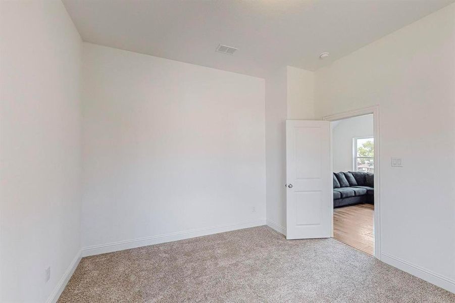 Upstairs Bedroom with access to living area and full bathroom.