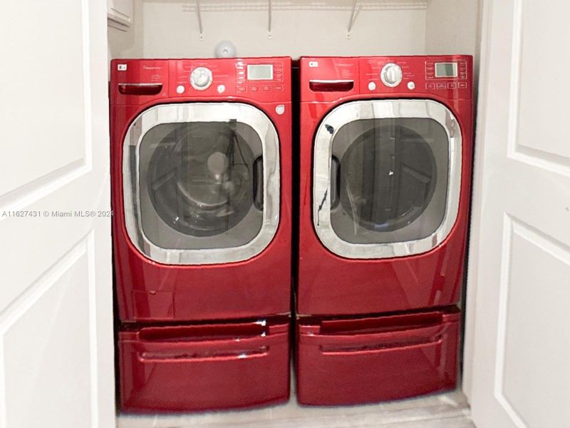 Front loading washer and dryer that fits perfectly in the laundry room with shelf for extra storage. See virtual tour to vie the laundry room