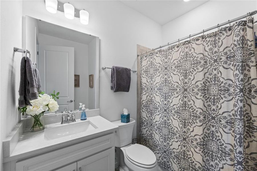 Quartz top vanity in guest bathroom