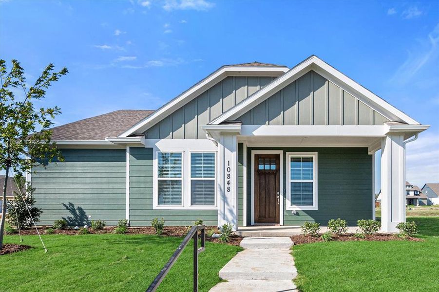 View of front of property with a front yard