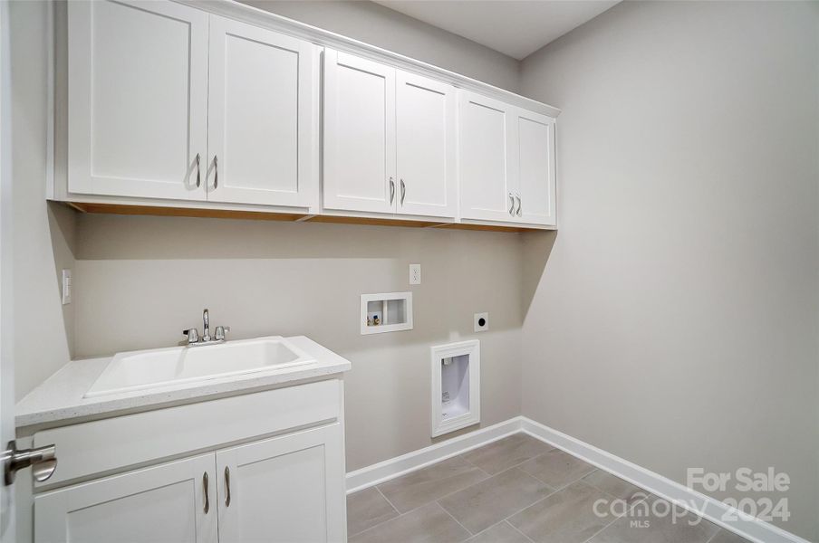 Laundry Room with Sink and Cabinets-Similar to Subject Property