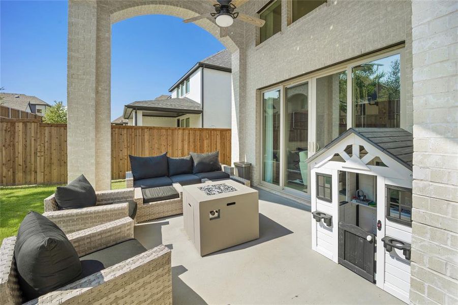 View of patio / terrace with an outdoor living space and ceiling fan