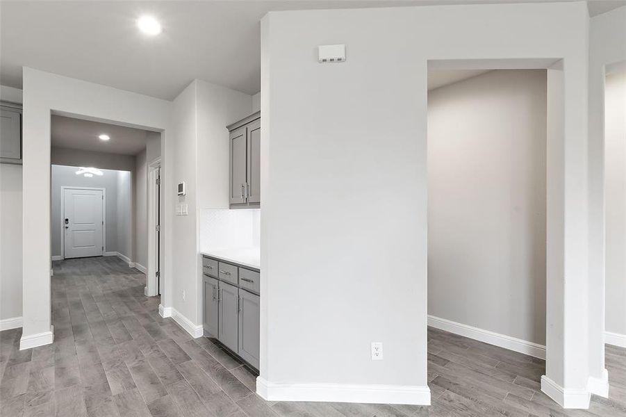 Hallway featuring light wood-type flooring