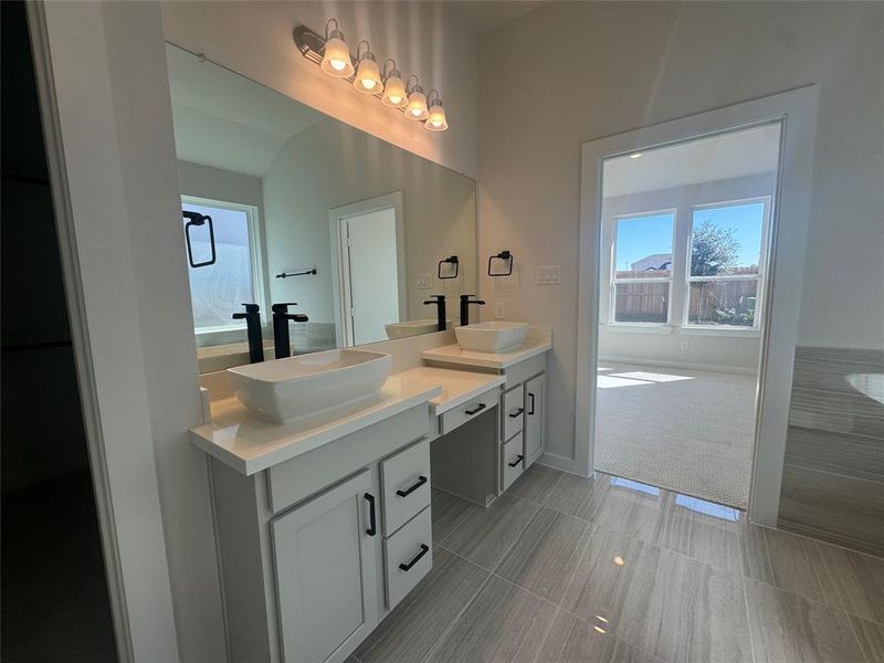 The Main Bathroom is elegantly designed and includes plenty of cabinet space and includes linen closet.