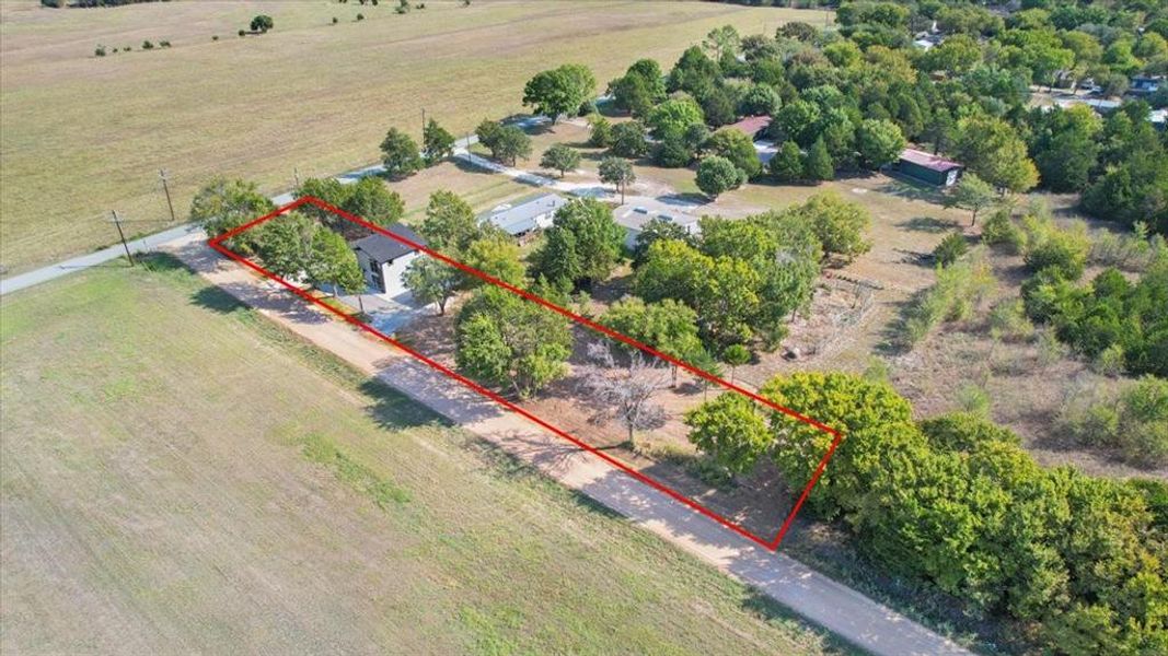 Birds eye view of property featuring a rural view