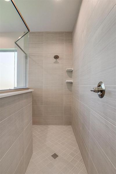 Bathroom with a tile shower