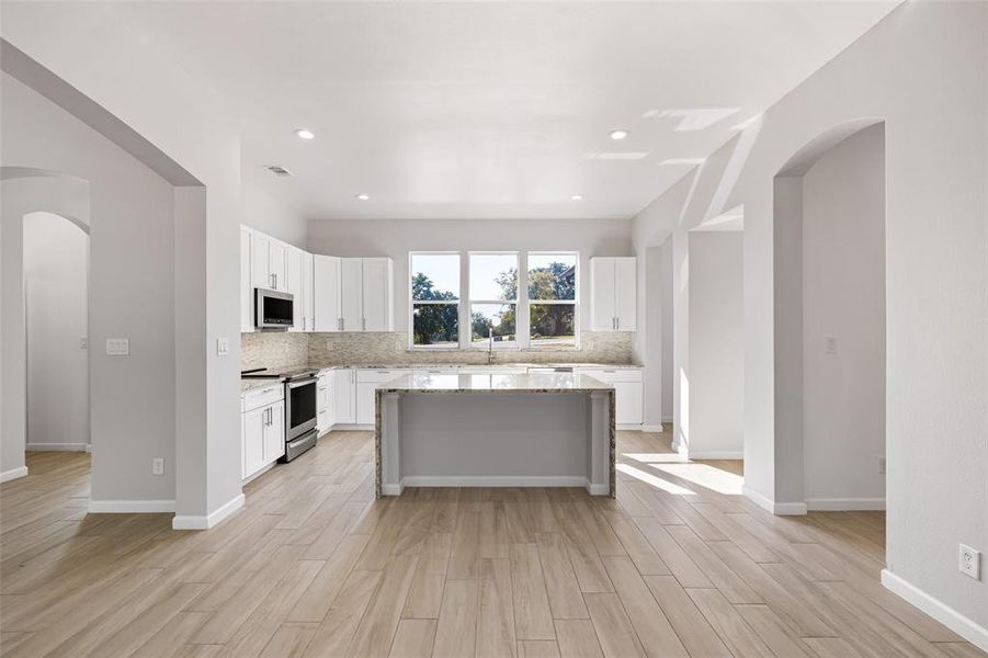 Island Kitchen With Breakfast Bar, Stainless Steel Appliances, Generous Cabinet Space & A Pretty View