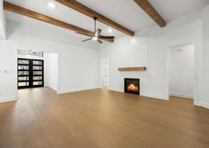 The spacious family room has an electric fireplace.