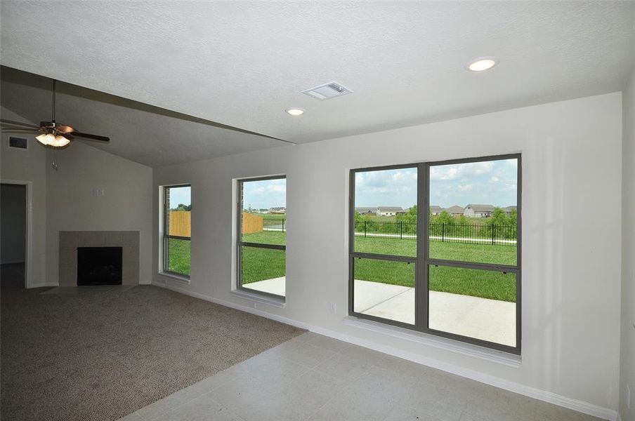 Windows across the rear of the home with a view of the lake.