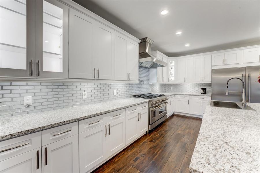 Highlighting the abundance of cabinet and countertop area this space offers.