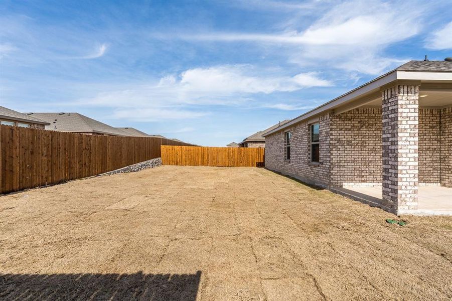 View of yard with a patio