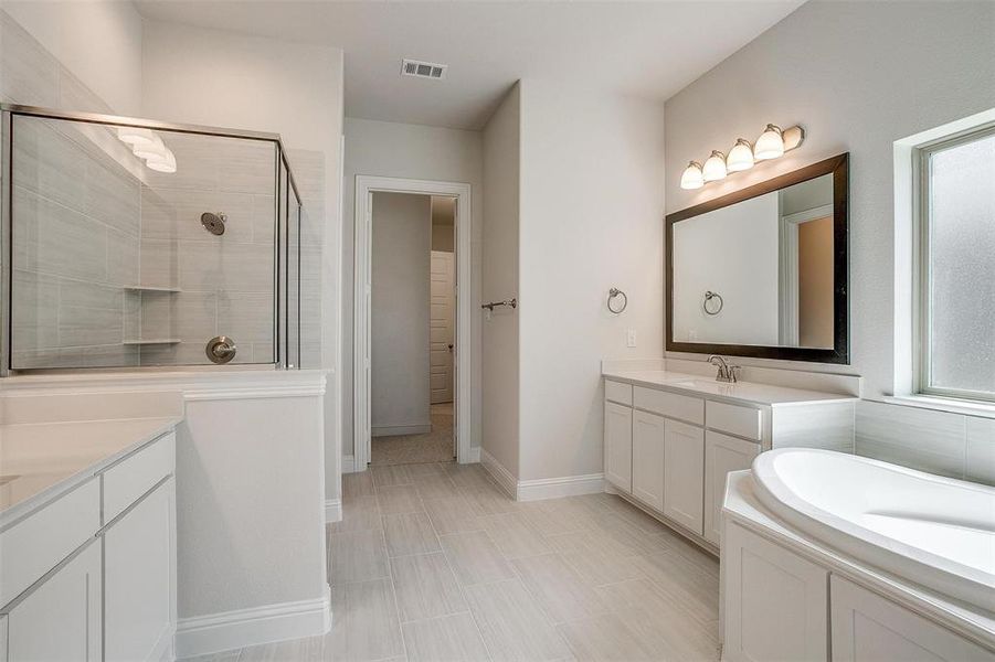 Bathroom with vanity and plus walk in shower