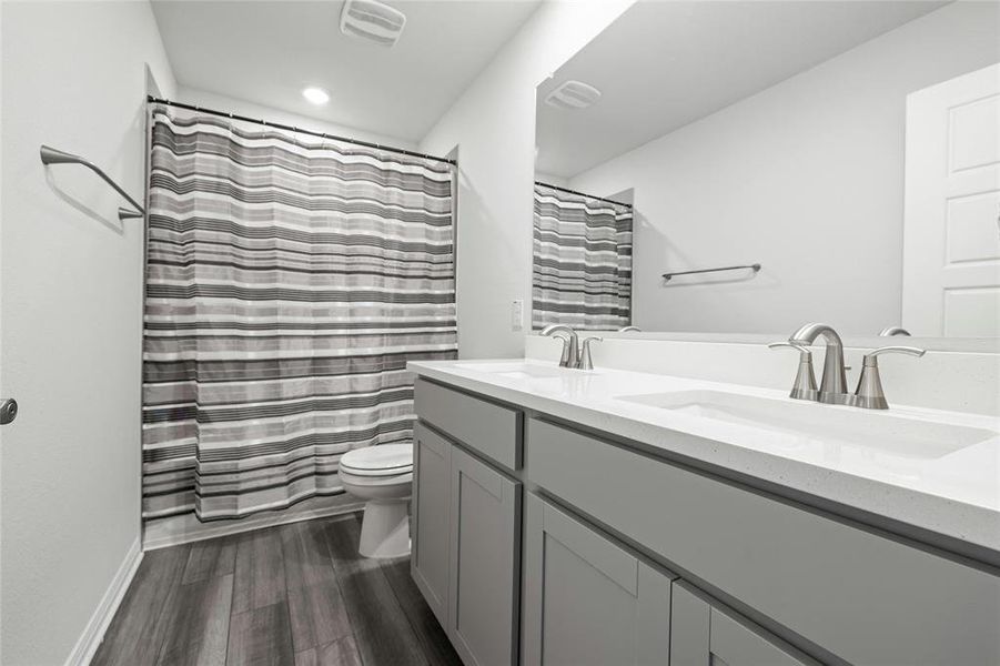 Secondary Bath Upstairs with Two Undermount Sinks and Quartz Counters.