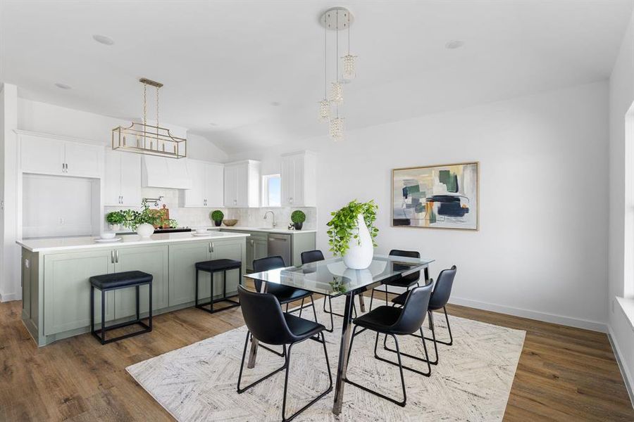 Dining room with lofted ceiling, dark hardwood / wood-style floors, and sink