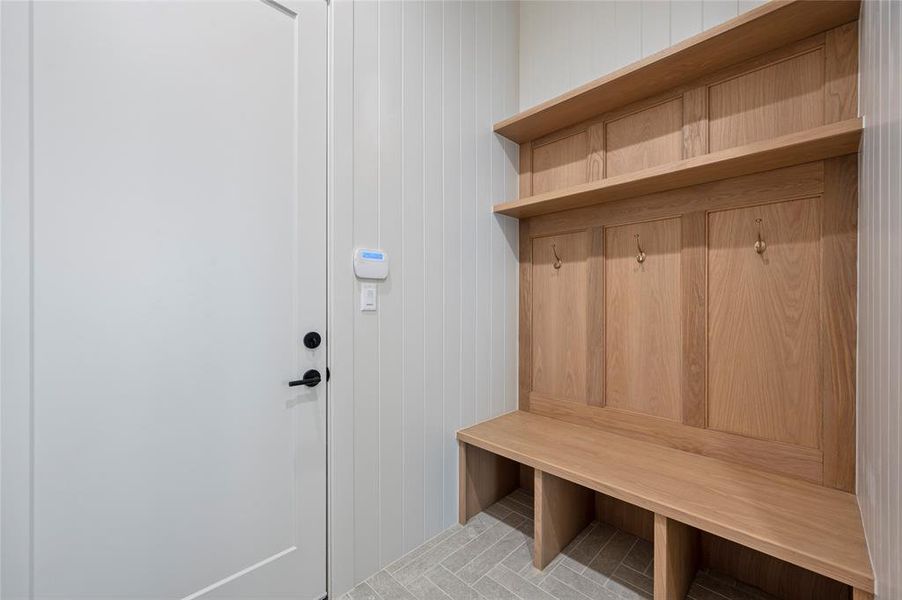 Mudroom entrance from garage goes straight into kitchen. Photo doesn't show how big mudroom really is