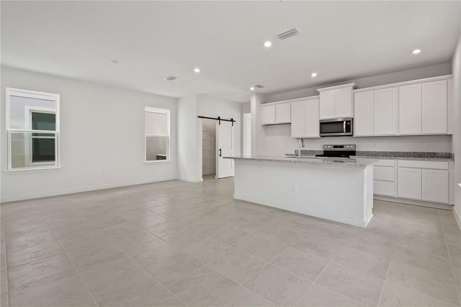 Spacious living room with eat-in kitchen.