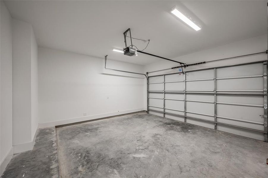 There is an ample two car garage with extra storage space.