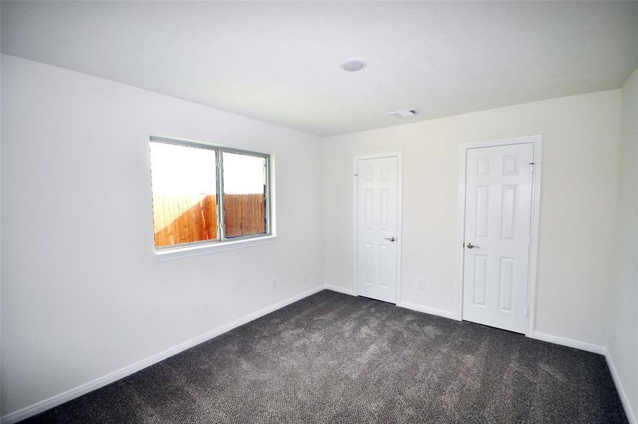 Rear Bedroom is ready for that special family member.   Separate and private with a full bath nearby.