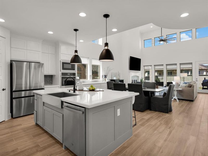 Seamless open floor plan connecting kitchen, dining, and living areas.