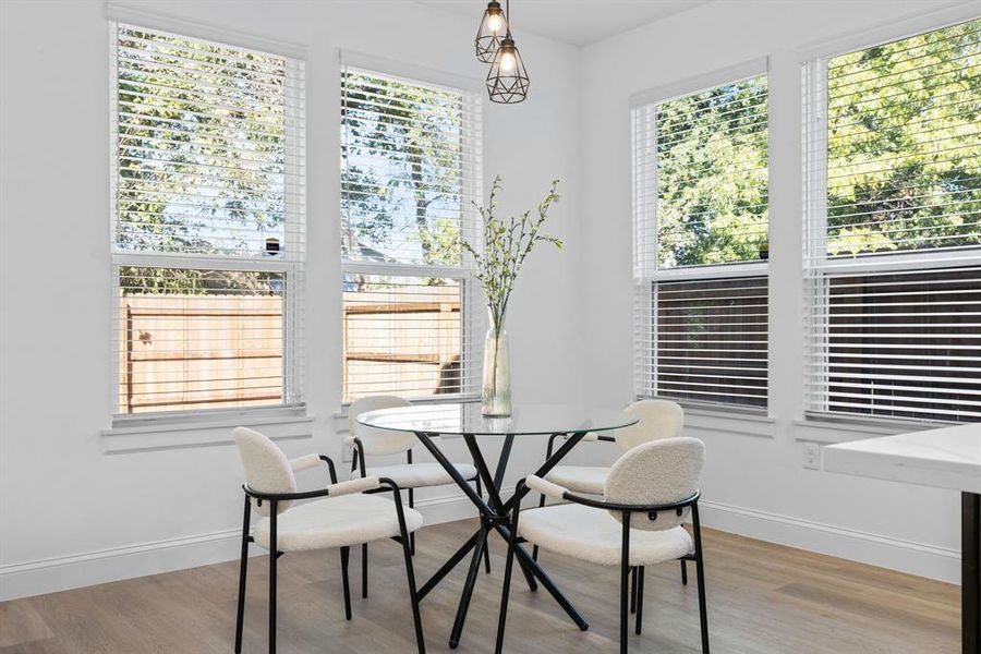 Dining space with light wood-type flooring