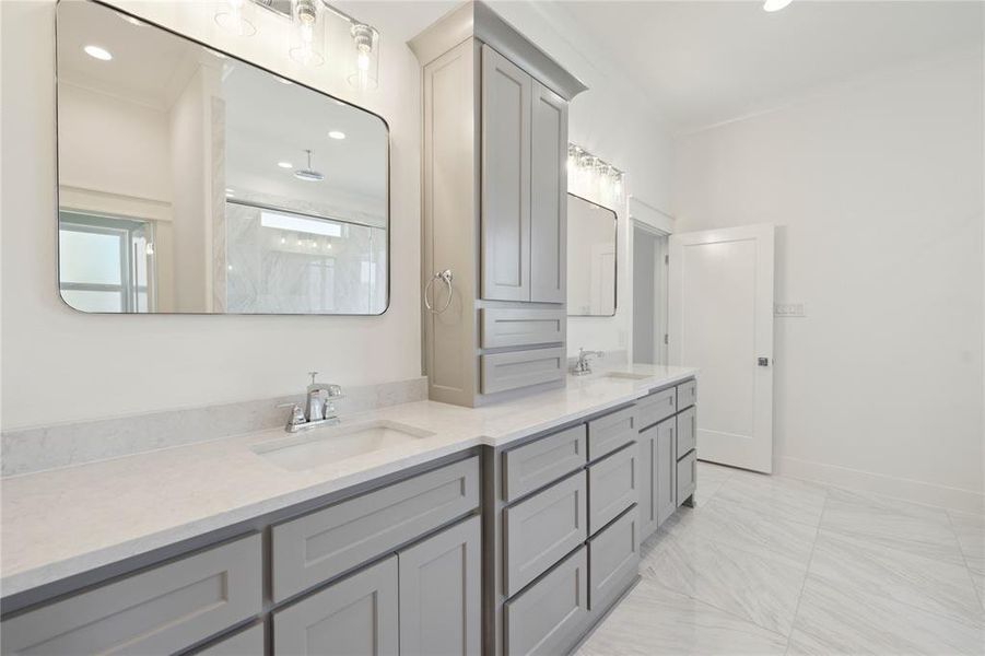 Bathroom featuring vanity and a shower with door