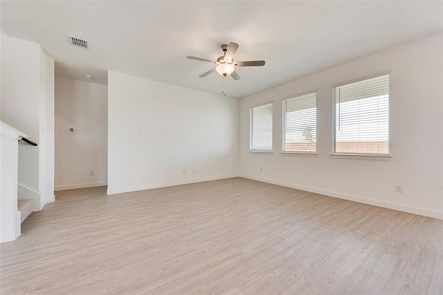 Unfurnished room featuring light hardwood / wood-style floors and ceiling fan