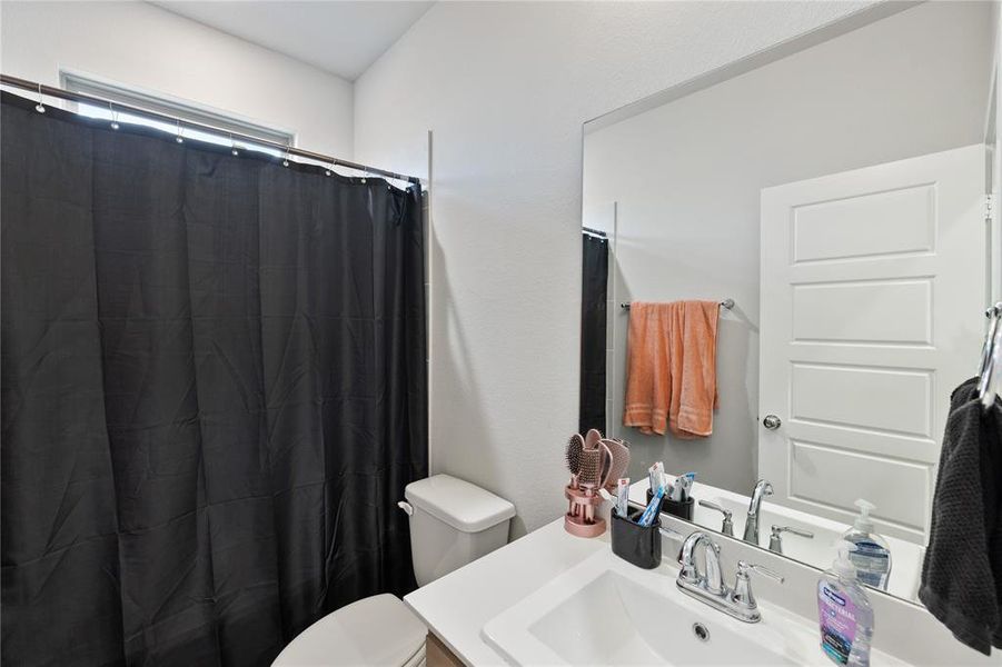 Bathroom featuring toilet and vanity