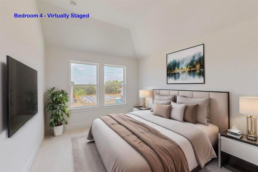 Carpeted bedroom featuring lofted ceiling