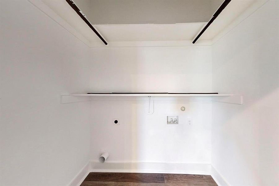 Laundry area featuring gas dryer hookup, dark hardwood / wood-style floors, hookup for an electric dryer, and washer hookup