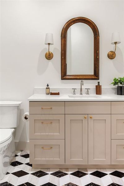 A mosaic tile adds character to the lower level full bath.